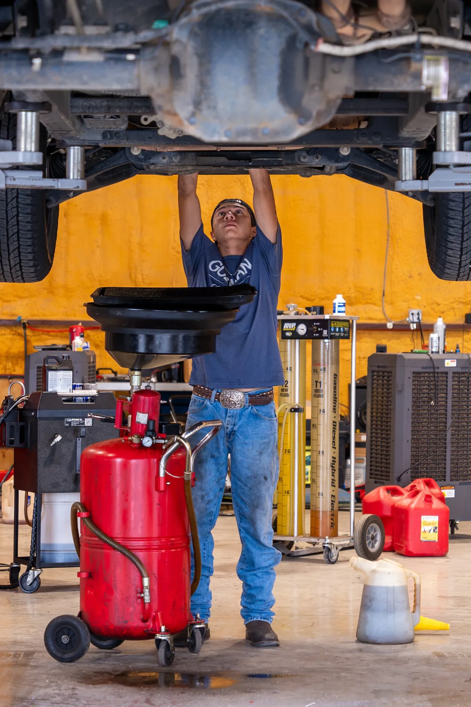 Guzman Automotive technician performing a pre-purchase inspection